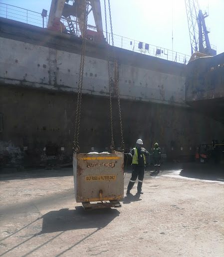 Supervising a crane lift at the harbour dry dock